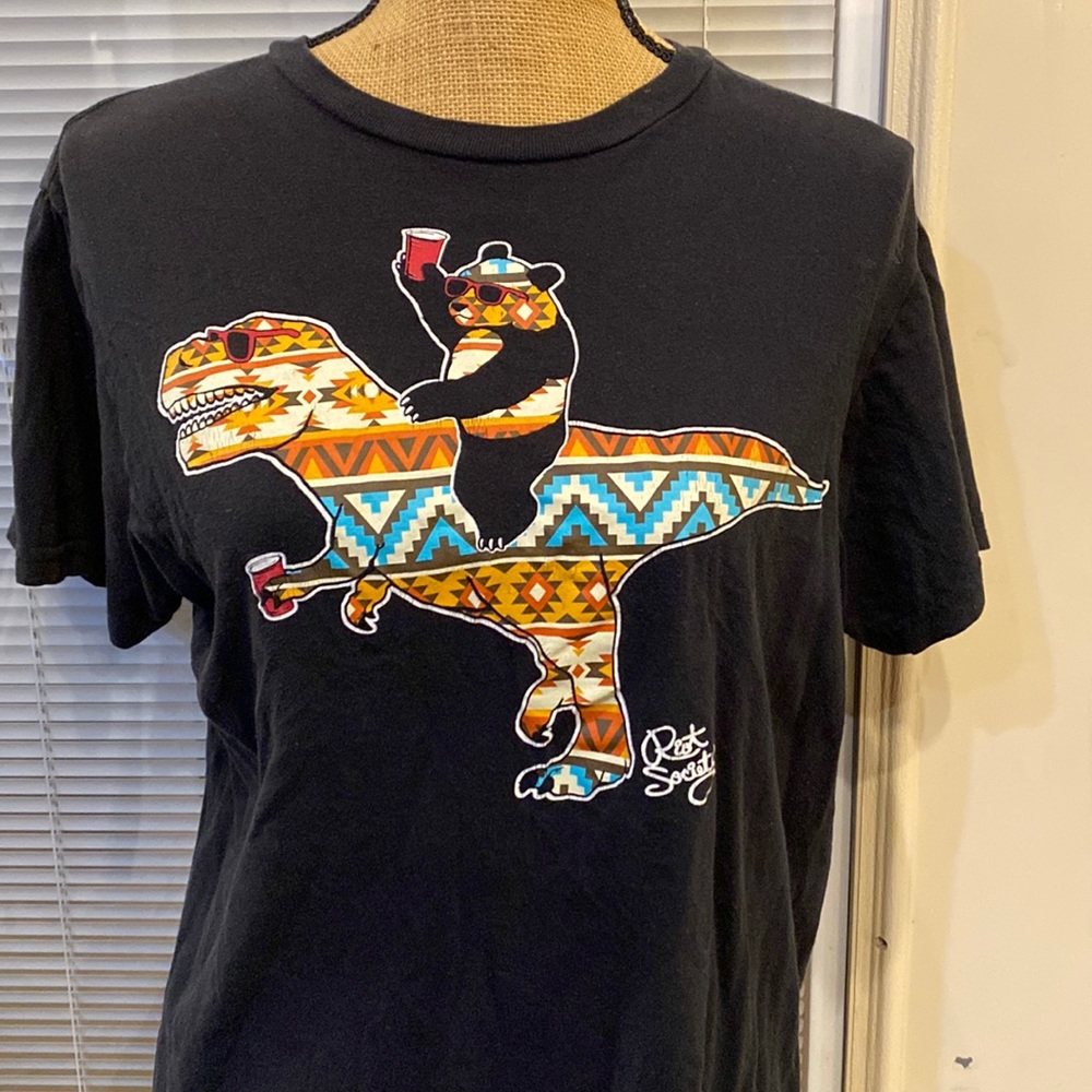 Panda on a dinosaur shirt